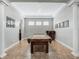 Spacious game room featuring a pool table, tray ceilings and easy access to other living spaces at 4903 Eastlake Vista Dr, St Cloud, FL 34771