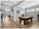 Open-concept game room featuring a pool table with easy access to the kitchen and Gathering room at 4903 Eastlake Vista Dr, St Cloud, FL 34771