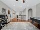 Upstairs hallway featuring wood floors, recessed lighting, and wrought iron railings at 4903 Eastlake Vista Dr, St Cloud, FL 34771