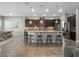 Spacious kitchen with a large island, granite countertops, stainless steel appliances, and pendant lighting at 4903 Eastlake Vista Dr, St Cloud, FL 34771