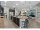 Open-concept kitchen with stainless steel appliances, a large island, and a view to the living area at 4903 Eastlake Vista Dr, St Cloud, FL 34771