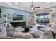 Spacious living room with coffered ceiling, large sectional sofa, and lake views at 4903 Eastlake Vista Dr, St Cloud, FL 34771