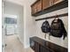 Mud room with storage, hooks, and a bench located near the laundry room at 4903 Eastlake Vista Dr, St Cloud, FL 34771