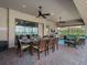 Outdoor patio with plenty of space for entertaining, ceiling fans, outdoor seating, and an outdoor kitchen at 4903 Eastlake Vista Dr, St Cloud, FL 34771