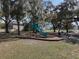 A charming playground nestled among mature trees, providing a delightful space for children to play outdoors at 4903 Eastlake Vista Dr, St Cloud, FL 34771