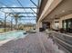 Relax and unwind in this screened pool area with a hot tub and ample patio space at 4903 Eastlake Vista Dr, St Cloud, FL 34771