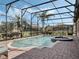 Enjoy the screened pool with a spa and beautifully landscaped backyard at 4903 Eastlake Vista Dr, St Cloud, FL 34771