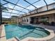 Inviting screened pool area with a spa, fountains, and a covered patio for outdoor relaxation at 4903 Eastlake Vista Dr, St Cloud, FL 34771