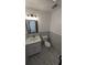 Clean bathroom featuring toilet, single sink vanity, and marble floors at 50 Avalon Ct, Casselberry, FL 32707