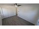 Bedroom with modern floors, closet with sliding doors and overhead fan at 50 Avalon Ct, Casselberry, FL 32707