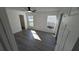 Bright bedroom featuring sleek gray floors, a ceiling fan and a closet at 50 Avalon Ct, Casselberry, FL 32707