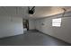 A spacious single-car garage with water heater in corner and painted brick wall at 50 Avalon Ct, Casselberry, FL 32707