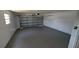 Spacious two-car garage with a gray painted floor and an automatic door opener at 50 Avalon Ct, Casselberry, FL 32707