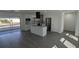 Bright and airy kitchen featuring new appliances, custom cabinetry and island at 50 Avalon Ct, Casselberry, FL 32707
