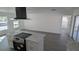 Kitchen area highlighting sleek appliances and a spacious island with modern finishes at 50 Avalon Ct, Casselberry, FL 32707