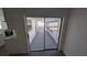 View of the enclosed lanai that opens to the back yard at 50 Avalon Ct, Casselberry, FL 32707