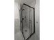 Modern bathroom shower with a sleek glass enclosure, black hardware, and marble tile surround at 50 Avalon Ct, Casselberry, FL 32707