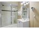 Modern bathroom with a glass-enclosed shower, tiled walls, and contemporary fixtures for a luxurious experience at 5076 Tideview Cir # 90, Orlando, FL 32819