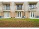 Back of building featuring balconies, patios, and well-maintained landscaping for enhanced curb appeal at 5076 Tideview Cir # 90, Orlando, FL 32819
