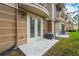 Exterior patio area featuring modern AC unit and French doors, offering a relaxing outdoor space at 5076 Tideview Cir # 90, Orlando, FL 32819
