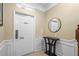 Inviting foyer featuring modern tile flooring, a console table and decorative mirror at 5076 Tideview Cir # 90, Orlando, FL 32819
