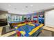 Fun-filled game room equipped with an air hockey table, a pool table and assorted arcade machines at 5076 Tideview Cir # 90, Orlando, FL 32819