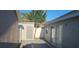 Backyard featuring neutral colored walls, a sliding glass door, and a detached shed under a blue sky at 513 Seasons Ct, Winter Springs, FL 32708