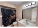 Bathroom with a vanity, mirror, toilet and tropical print shower curtain at 513 Seasons Ct, Winter Springs, FL 32708