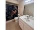 Bathroom featuring a sink with a large mirror, decorative shower curtain, toilet and tiled flooring at 513 Seasons Ct, Winter Springs, FL 32708