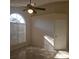 A bright room with a ceiling fan and an arched window that allows plenty of natural light to flood the space at 513 Seasons Ct, Winter Springs, FL 32708