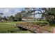 Community park featuring basketball courts, pavilions, walking paths, and a small bridge at 513 Seasons Ct, Winter Springs, FL 32708