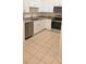 Updated kitchen featuring stainless steel dishwasher, granite counters, and modern cabinets at 513 Seasons Ct, Winter Springs, FL 32708