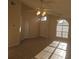 Bright living room with tile floors, high ceilings, and arched windows for plenty of natural light at 513 Seasons Ct, Winter Springs, FL 32708