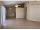 Large living room with ceiling fans, neutral colors, and tile flooring for easy maintenance at 513 Seasons Ct, Winter Springs, FL 32708