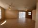 Large open living space with tile flooring, fan, and sliding glass doors to the backyard at 513 Seasons Ct, Winter Springs, FL 32708