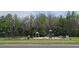 Community playground featuring swings, slides, and other play equipment surrounded by lush greenery at 513 Seasons Ct, Winter Springs, FL 32708