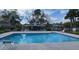 Community pool with shaded area for relaxation and enjoyment at 513 Seasons Ct, Winter Springs, FL 32708