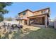 Backyard featuring a fire pit with chairs and a covered patio with furniture at 583 Treehouse St, Winter Springs, FL 32708