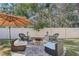Backyard oasis complete with outdoor seating area and a charming fire pit at 583 Treehouse St, Winter Springs, FL 32708