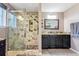 Modern bathroom featuring a shower with glass door and a dual sink vanity at 583 Treehouse St, Winter Springs, FL 32708