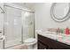 Bathroom featuring a shower with glass doors and a vanity with granite countertops at 583 Treehouse St, Winter Springs, FL 32708