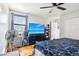 Bedroom featuring wood-look floors, ceiling fan and TV on a dresser with drawers at 583 Treehouse St, Winter Springs, FL 32708