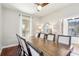 Formal dining room with a large table, seating for eight, and natural light at 583 Treehouse St, Winter Springs, FL 32708