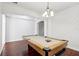 Game room showcasing a pool table with hardwood floors and decorative molding at 583 Treehouse St, Winter Springs, FL 32708