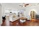 Spacious living room featuring wood floors and a connected Kitchen at 583 Treehouse St, Winter Springs, FL 32708