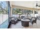 Screened patio with a tile floor and outdoor seating around a fire pit at 583 Treehouse St, Winter Springs, FL 32708
