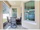 Covered patio featuring a stone floor and outdoor seating area at 583 Treehouse St, Winter Springs, FL 32708