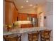 Bright kitchen boasts granite countertops, stainless steel appliances and a convenient breakfast bar at 8011 Saint James Way, Mount Dora, FL 32757