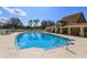 Community pool with inviting blue water, lounge chairs, and a spacious deck for relaxation and recreation at 8011 Saint James Way, Mount Dora, FL 32757