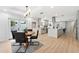 Dining area showcasing the beautifully remodeled open-concept kitchen with modern gray cabinets at 9333 Bay Vista Estates Blvd, Orlando, FL 32836